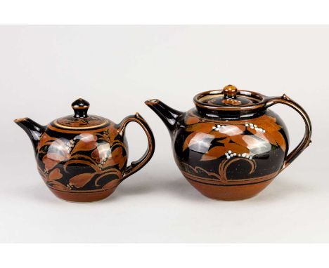 † DEREK EMMS (1929-2004); a stoneware teapot covered in tenmoku and kaki glaze, impressed DE mark, height 14.5cm, and a simil