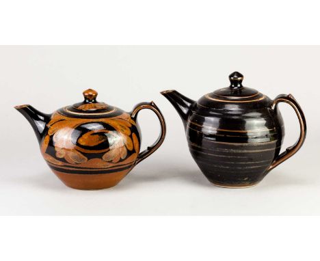 † DEREK EMMS (1929-2004); a stoneware teapot covered in tenmoku breaking to kaki glaze, impressed DE mark, height 16.5cm, and
