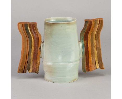 † COLIN PEARSON (1923-2007); a porcelain winged vessel partially covered in celadon glaze, the wings formed of strips of porc