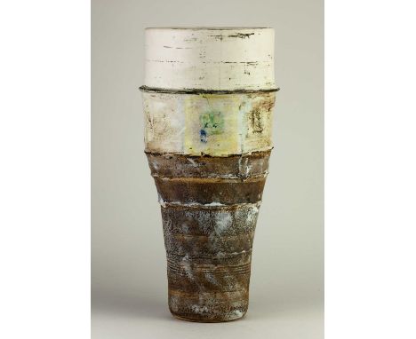 † ROBIN WELCH (1936-2019); a tall tapered stoneware vessel with bands iron, grey and cream glaze decorated with green and yel
