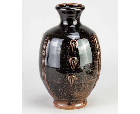 JIM MALONE (born 1946); a stoneware bottle covered in tenmoku breaking to kaki glaze with incised decoration, impressed JM an