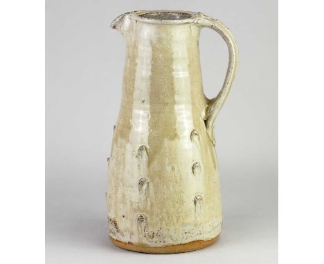 JIM MALONE (born 1946); a large stoneware pitcher covered in green ash glaze with incised decoration, impressed JM and L (for