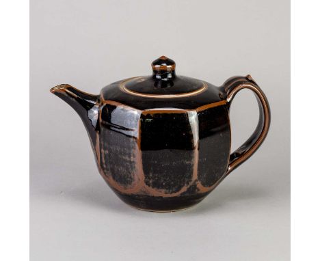 † DEREK EMMS (1929-2004); a cut sided stoneware teapot covered in tenmoku breaking to kaki glaze, impressed DE mark, height 1