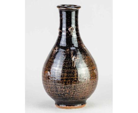 JIM MALONE (born 1946); a stoneware Korean bottle covered in tenmoku breaking to kaki glaze with incised decoration, impresse