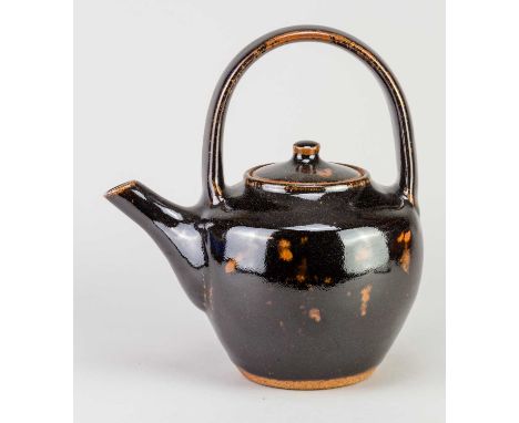 † JIM MALONE (born 1946); a stoneware teapot covered in tenmoku breaking to kaki glaze, impressed JM and A (for Ainstable) ma