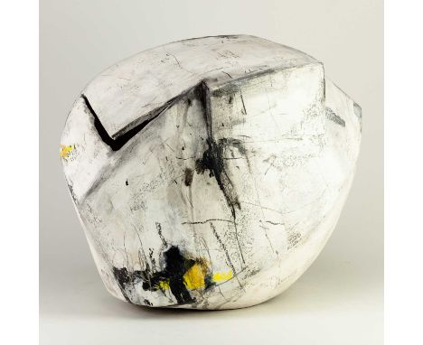 REBECCA APPLEBY (born 1979); an earthenware angular boulder form with an L shaped aperture covered in white slip decorated wi
