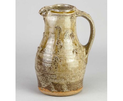 JIM MALONE (born 1946); a stoneware baluster jug covered in green ash and iron glaze with incised decoration, impressed JM an