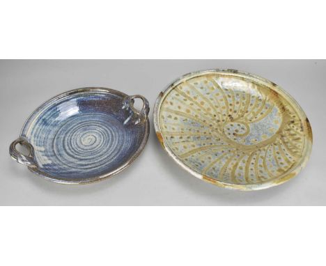 A large shallow stoneware dish with radiating decoration and gold spots, diameter 38.5cm, and a twin handled dish covered in 