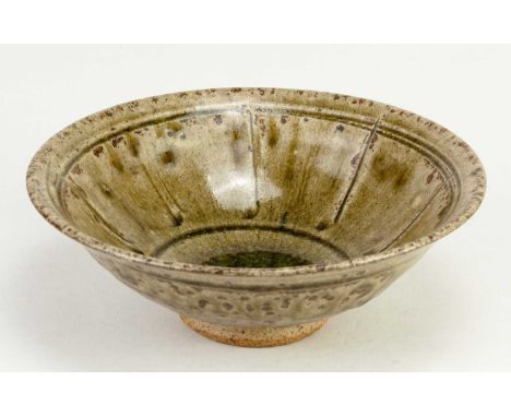 † JIM MALONE (born 1946); a stoneware bowl covered in green ash glaze with incised decoration, impressed JM mark, diameter 16