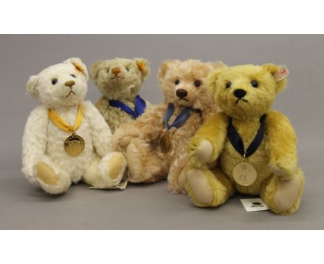 Four Steiff teddy bears, each housed in a Steiff display case - 2004 Bear of the Year, 2008 Bear of the Year, 2010 Growling B