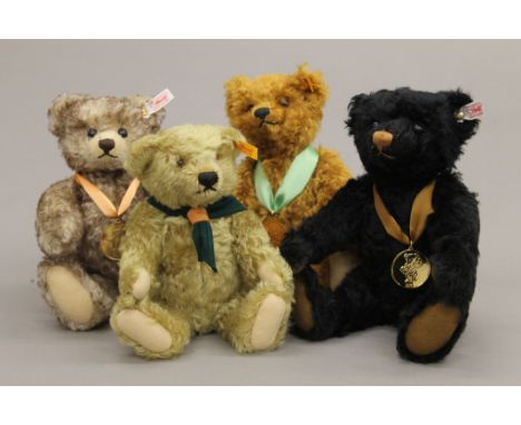 Four Steiff teddy bears, each housed in a Steiff display case - 2007 Bear of the Year, 2009 Bear of the Year, The Scouts Cent