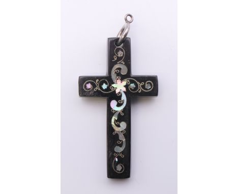 A mother-of-pearl inlaid tortoiseshell cross. 6.25 cm high.
