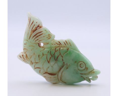 A jade fish pendant. 6 cm long.