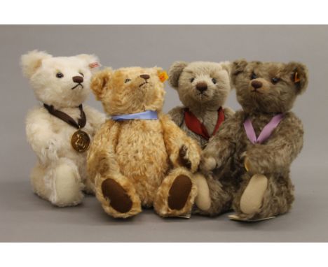 Four Steiff teddy bears, each housed in a Steiff display case - 2002 Bear of the Year, 2006 Bear of the Year, 2013 Bear of th