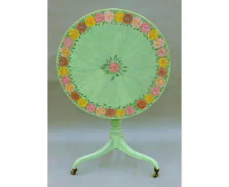 A florally painted tilt top tripod table. 76 cm diameter.