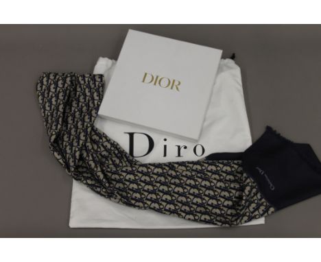 A Christian Dior silk scarf in box, in dust bag. The scarf 196 cm long.