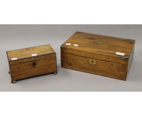 A Victorian walnut writing slope and a mahogany tea caddy. The former 35 cm wide.