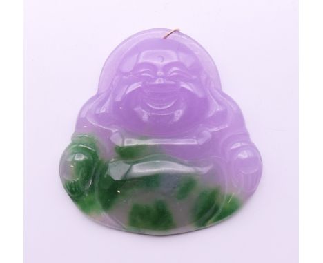 A two tone jade Buddha pendant with gold suspension loop. 5 cm high.