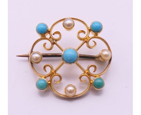 A 19th century 15 ct gold turquoise and pearl brooch. 2 cm diameter.
