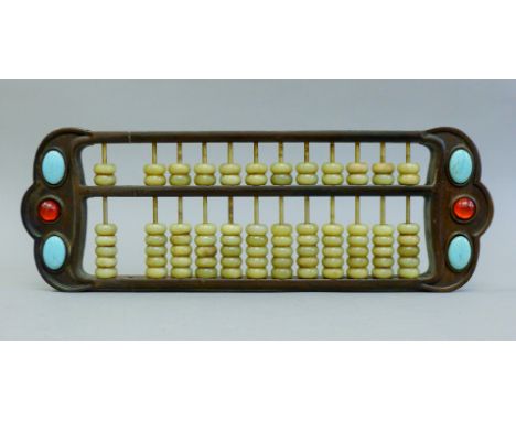 A Chinese jade mounted abacus. 42 cm long.
