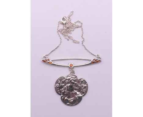 An Art Nouveau silver pendant on chain. 6 cm wide.