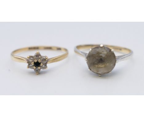 A 9 ct gold ring, and a 9 ct gold and silver ring. 2.8 grammes total weight.