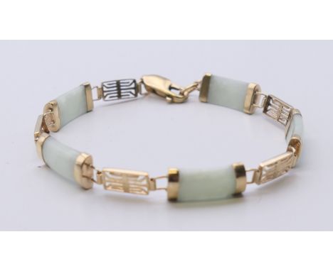 A Chinese 9 ct gold and jade bracelet. 16 cm long.