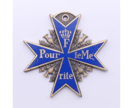 A Continental blue enamel medallion. 5 cm wide.