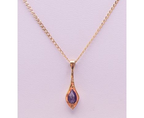 A 9 K gold and amethyst pendant on a 9 K gold chain. The pendant 2.25 cm high. 2.1 grammes total weight. 