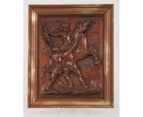   Een notenhouten snijwerk reliëf voorstellende Jeanne d'Arc, 20e eeuw. Geschatte opbrengst: € 10 - € 20.        A nutwood pa