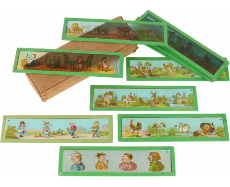   Een doosje toverlantaarn plaatjes. Geschatte opbrengst: € 10 - € 50.        A box of magic lantern pictures. Estimate: € 10