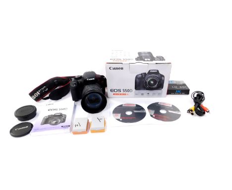 A Canon EOS 550D Digital camera, with an EF-S18-55 IS kit, including a Canon zoom lens EF-S18-55mm 1:3.5-5.6IS zoom lens, box