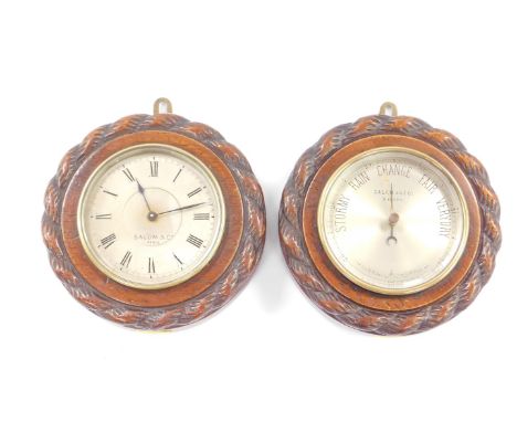 A French early 20thC oak cased wall clock and matching barometer, by Salom &amp; Co Paris, silvered dials, the case with rope