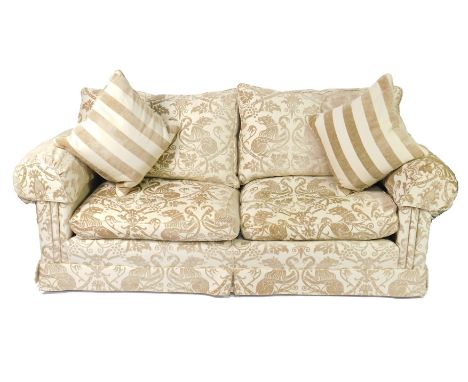 A Duresta two seater sofa, upholstered in fawn Gothic vine and lion fabric, together with two striped cushions, 226cm L.