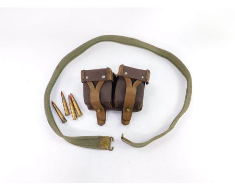 A Russian brown leather two pocket ammunition belt, together with a canvas military belt. (2)