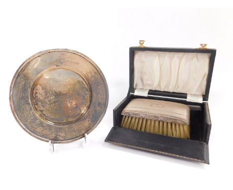 A silver circular dish, stamped sterling, 2.46oz together with a silver backed hair brush, with engine turned decoration, res
