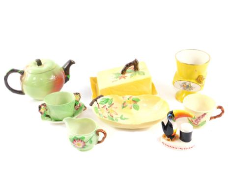 A group of Carlton ware pottery, including an apple shaped teapot, My Goodness My Guinness Toucan, and leaf moulded wares. (q