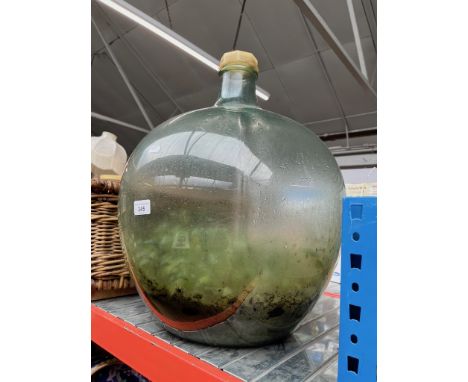 A large glass carboy ( bottle garden ). 