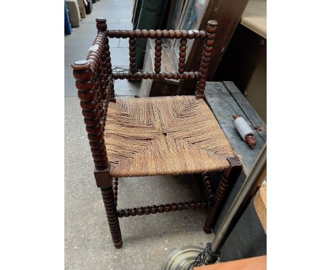 A turned bobbin corner chair. 