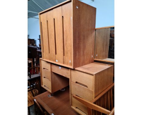 A mid 20th century Stag light oak dressing table and matching chest of drawers. 