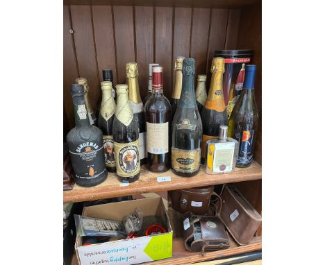 A selection of alcoholic beverages to include ale, wine, whisky, rum, port, champagne, etc. 