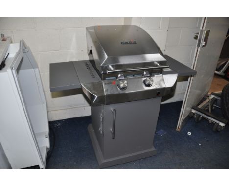 A CHAR-BROIL PERFORMANCE AMERICAN BARBECUE on stand (this item is brand new, was still packaged until erected by our team)