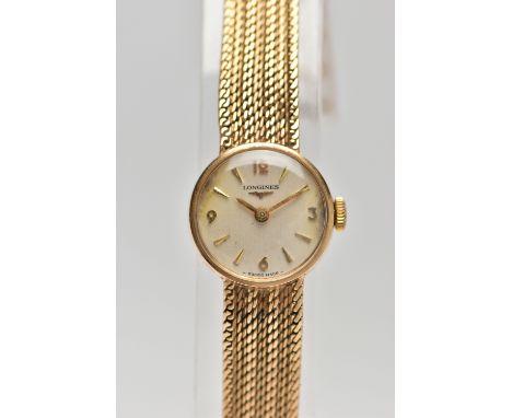 A LADIES 9CT GOLD 'LONGINES' WRISTWATCH, manual wind, round silver dial signed 'Longines', Arabic twelve. three, six and nine