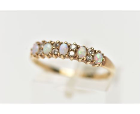 A 9CT GOLD OPAL AND DIAMOND HALF ETERNITY RING, designed with five oval cut opal cabochons, each interspaced with two small r