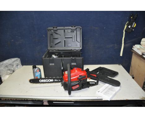 A MOUNTFIELD MC3720 PETROL CHAINSAW, with carrying case, engine and chain oils (engine pulls freely but hasn't started)