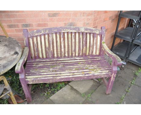 A WOODEN SLATTED GARDEN BENCH width 124cm (Condition distressed paint work but sturdy)