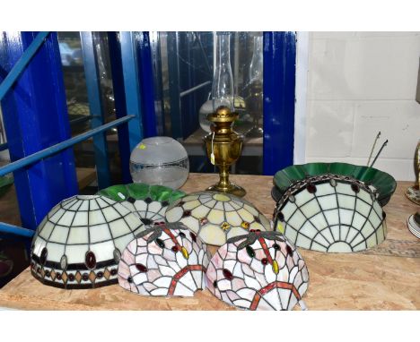 A GROUP OF GLASS LIGHTSHADES, LIGHT FITTINGS AND AN OIL LAMP, comprising three leaded glass ceiling shades, largest diameter 