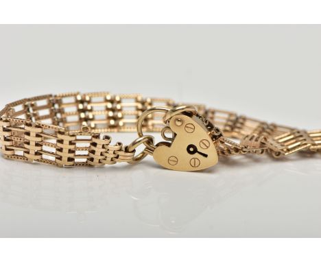 A 9CT GOLD GATE BRACELET, designed with a series of five bar links, some textured some plain polished, hallmarked 9ct Birming