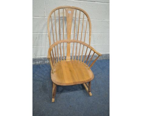 AN ERCOL ELM AND BEECH ROCKING CHAIR (condition - ideal for restoration due to discolouration, water stains, frame solid, fro