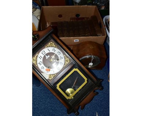 A BOX AND LOOSE BOOKS AND CLOCKS, comprising a Lava 31 day wall clock, a twentieth century wooden cased mantel clock, eight v